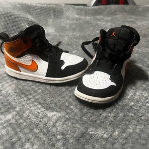 - Black and Orange Jordan 1’s.They are missing the inside soles.